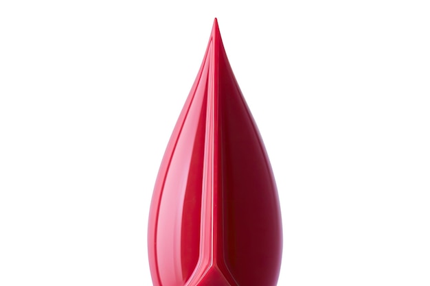 A red vase with a pointy shape and a red top.