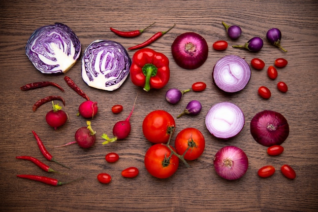 Red vegetables set on wooden background