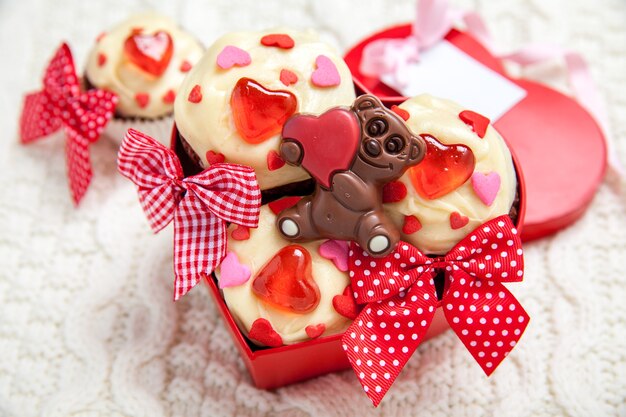 Red velvet cupcakes decorated with hearts for Valentine's day