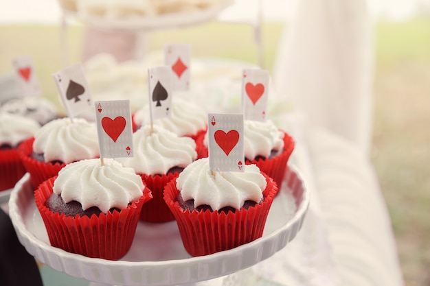 Red velvet cupcakes with playing cards toppers