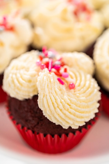 Red velvet cupcakes with white chocolate ganache frosting