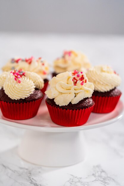 Red velvet cupcakes with white chocolate ganache frosting