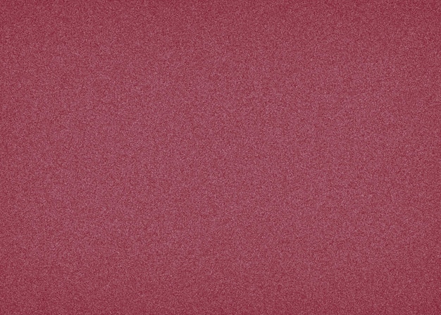 A red velvet fabric with a rough textured surface.