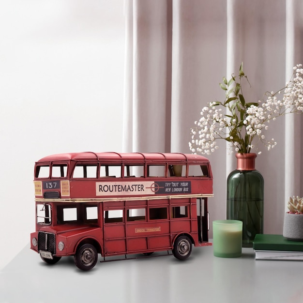 red vintage classic london bus on table