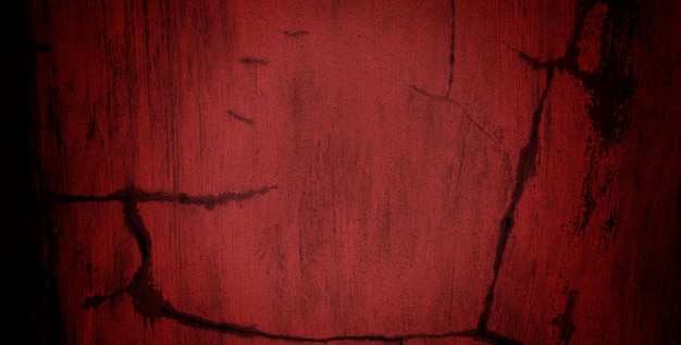 A red wall with a face drawn in black ink.