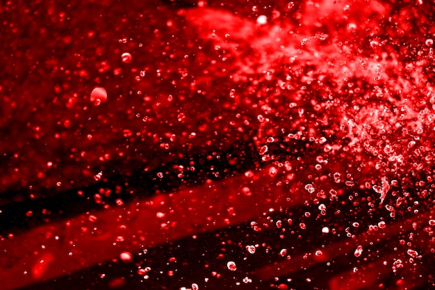 red water splash on the black background. 