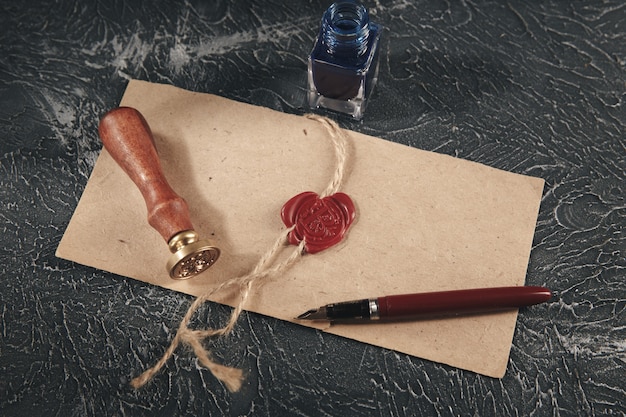 Red wax stamp on the paper document isolated.