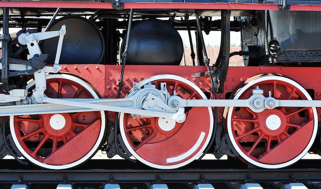 Red wheels of old steam locomotive