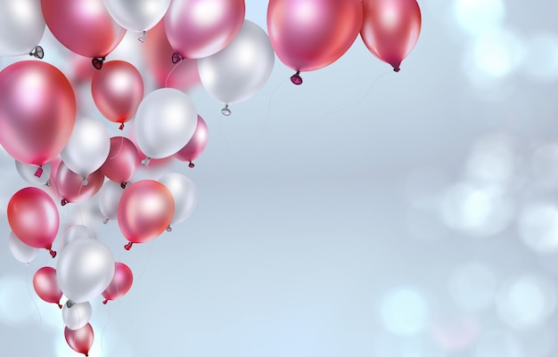 Red and white balloons on light blurred background