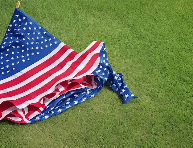 a red, white and blue flag is laying on the grass.