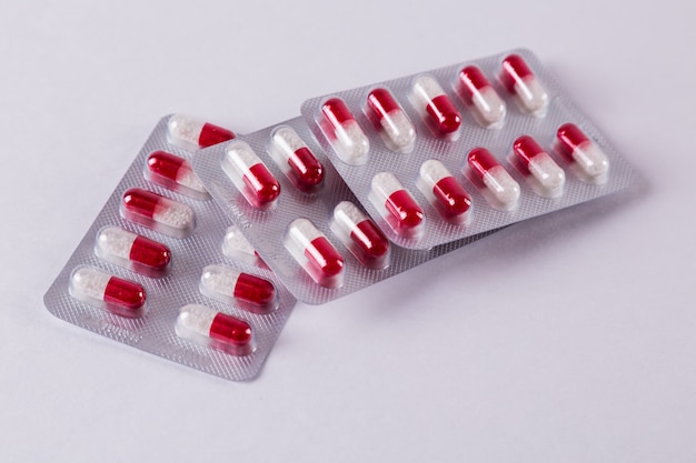 Red-white capsules on white 