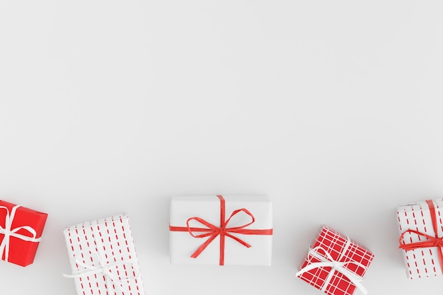 Red and white christmas gifts on a white table Flat lay with blank copy space