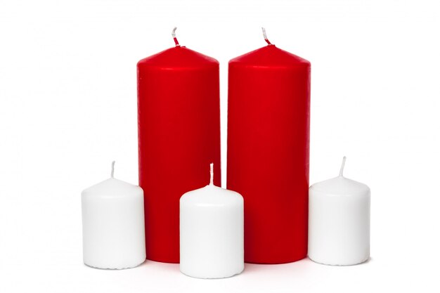 Red and white colored xmas candles isolated on white 