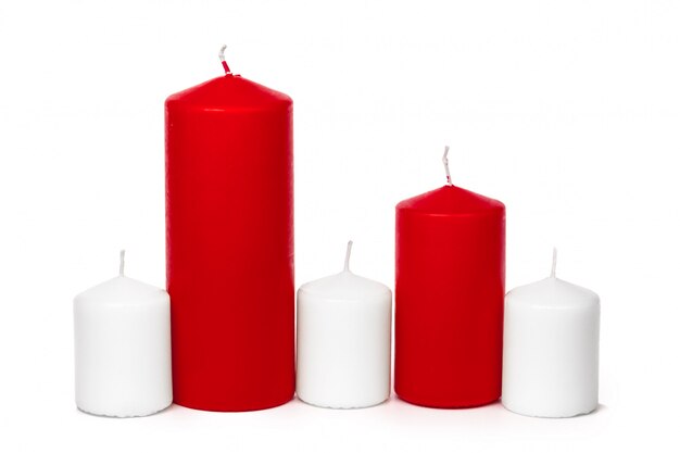 Red and white colored xmas candles isolated  