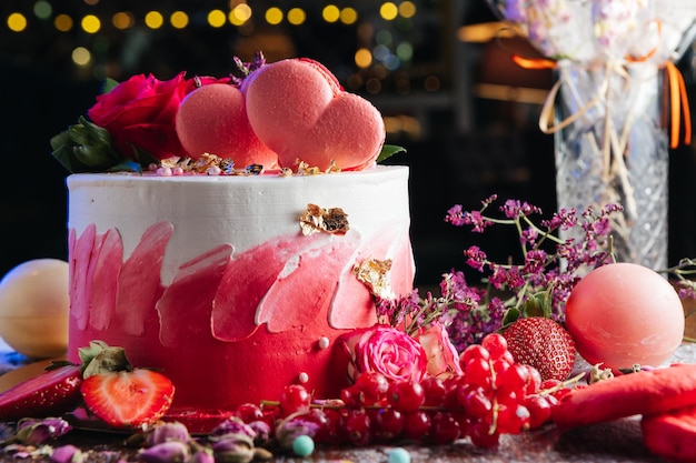 Red white cream cake with roses and hearts