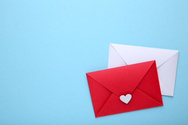 Red and white envelopes on blue background