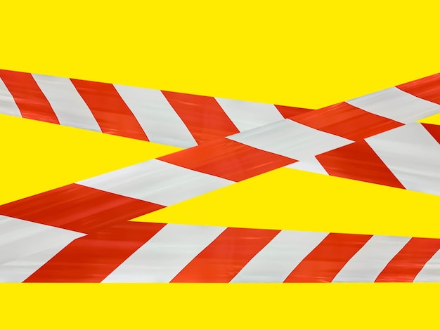 Red and white lines of barrier tape prohibit passage.