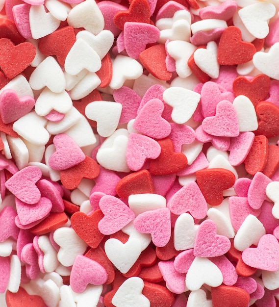 Red white and pink heart shapes sprinkles background