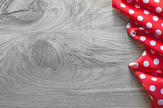 Red white polkadot table cloth on natural wooden board