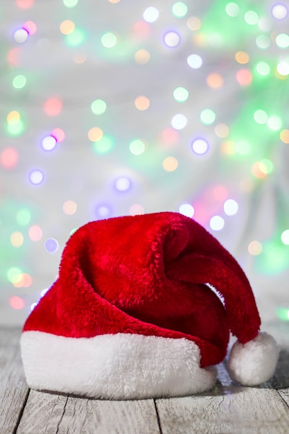 Red and white santa hat against bokeh background