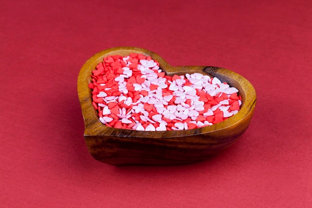 Red and white sweet heart shaped candies for decorating desserts and cakes