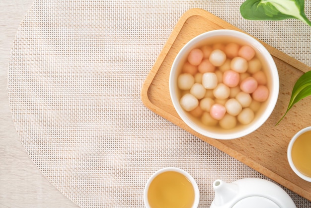 Red and white tangyuan with syrup soup