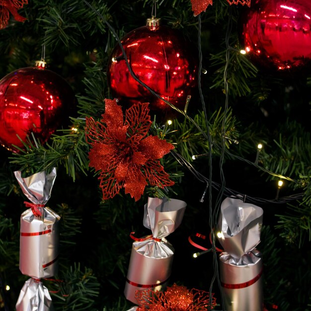 Red and white toys on Christmas tree