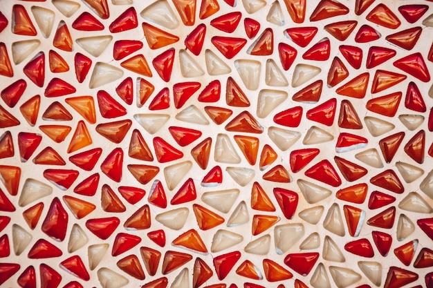 Photo red and white triangle glass tiles as background