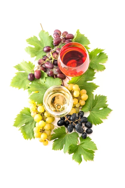 Red and white wine glasses and grape on white background Food and beverages