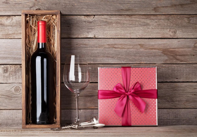 Red wine bottle gift box and wine glass