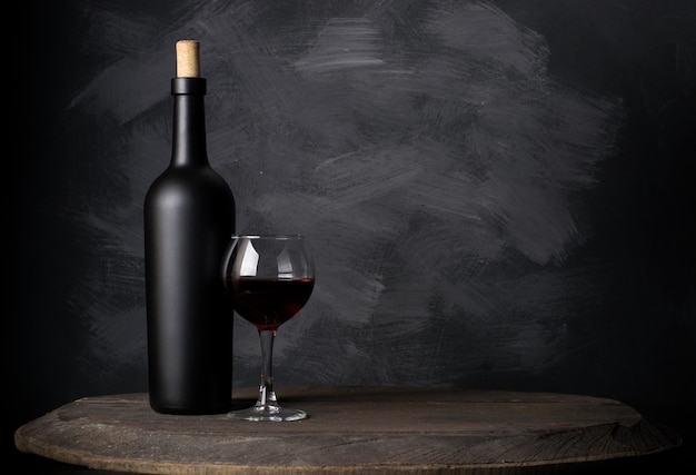 Red wine bottle on wood