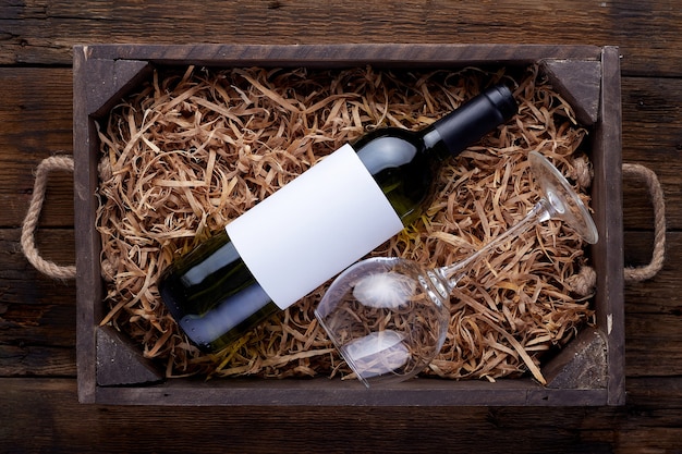 Red wine bottles packed in open wooden box