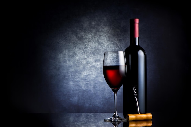 Red wine composition on a black background