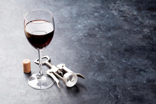 Red wine glass and corkscrew