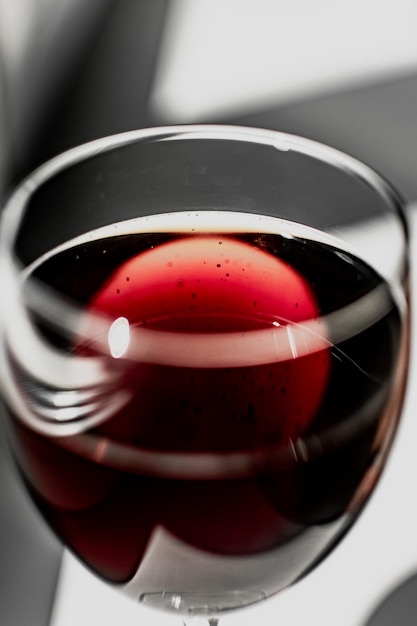red wine in a glass glass on a white background