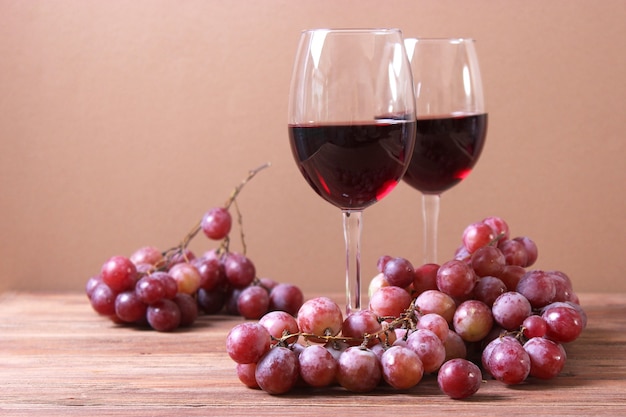 Red wine and grapes on the table top view