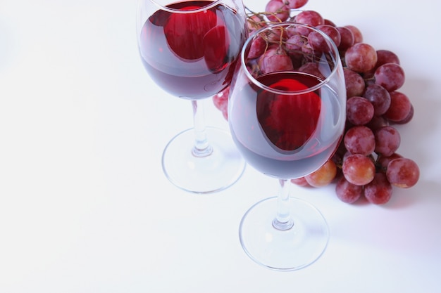 Red wine and grapes on the table top view