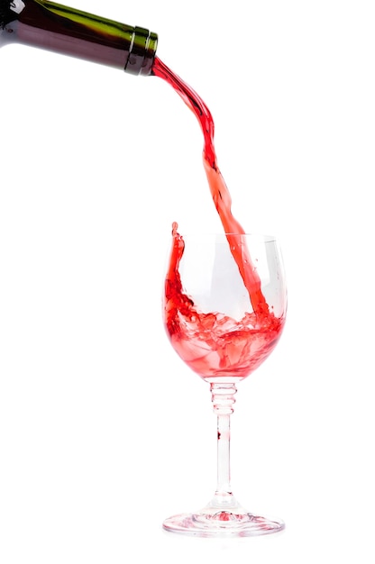 Red wine pouring into wine glass