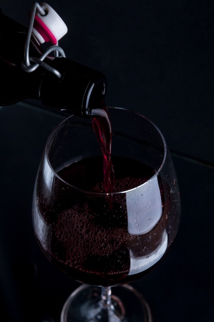 Red wine pouring into a wineglass.