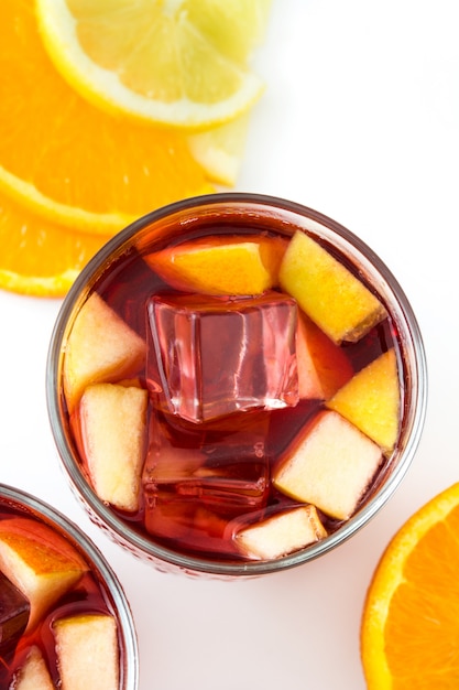 Red wine sangria in glass on white