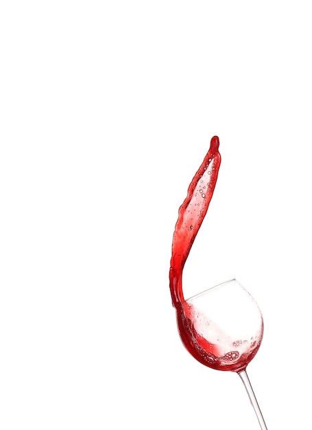 Red wine splashing from glass isolated on white background