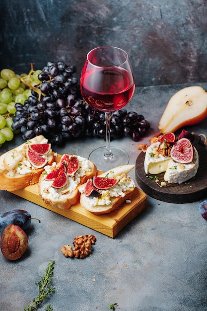Red wine with snacks bruschetta with pears cottage cheese figs\
thyme nuts and honey camembert cheese