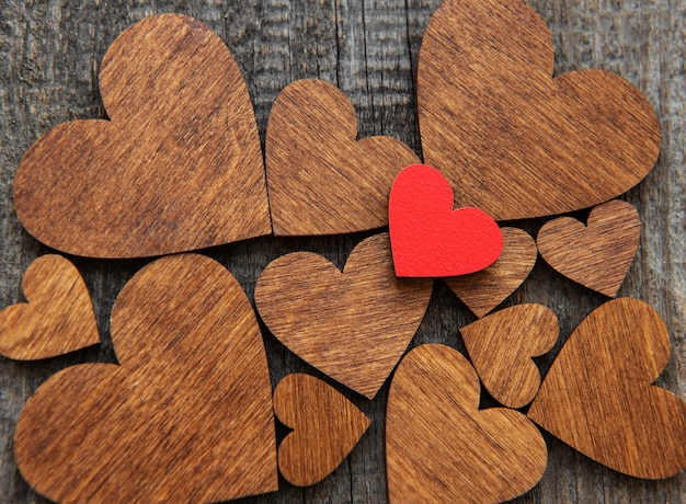 Red wooden heart on a wooden heart