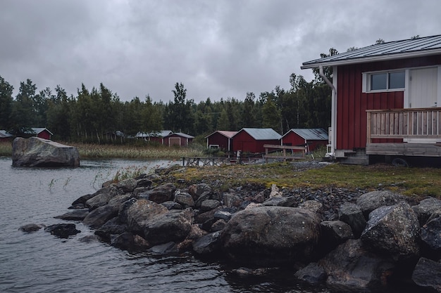 red wooden houses on the seashore in Harrstron Finland