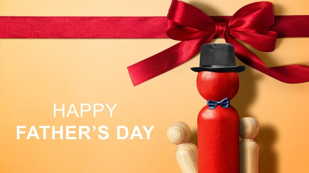 Red wooden peg doll with a black hat and bow tie with a Happy Fathers Day message