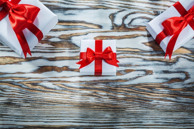 Red wrapped present box on wooden surface