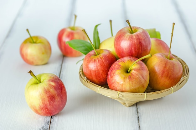 Red and yellow apple   on wooden background