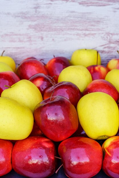 Red and yellow apples placed in a container box and with copy space