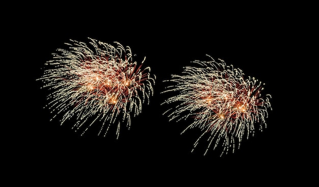 Red and yellow fireworks explosion on night sky