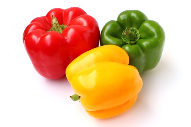 Red, yellow and green sweet peppers isolated